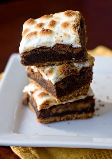 A piece of cake on a plate, with Chocolate and Cookie