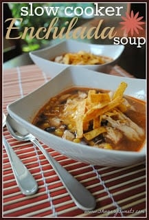 A bowl of food on a table, with Soup and Chicken