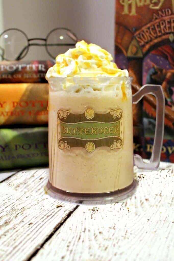 Copycat Harry Potter Frozen Butterbeer on a table in front of Harry Potter Books
