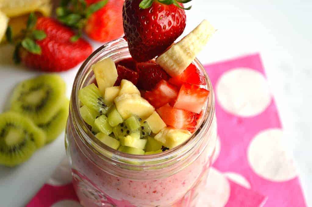 A bowl of fruit and vegetables in a cup, with Smoothie and Parfait