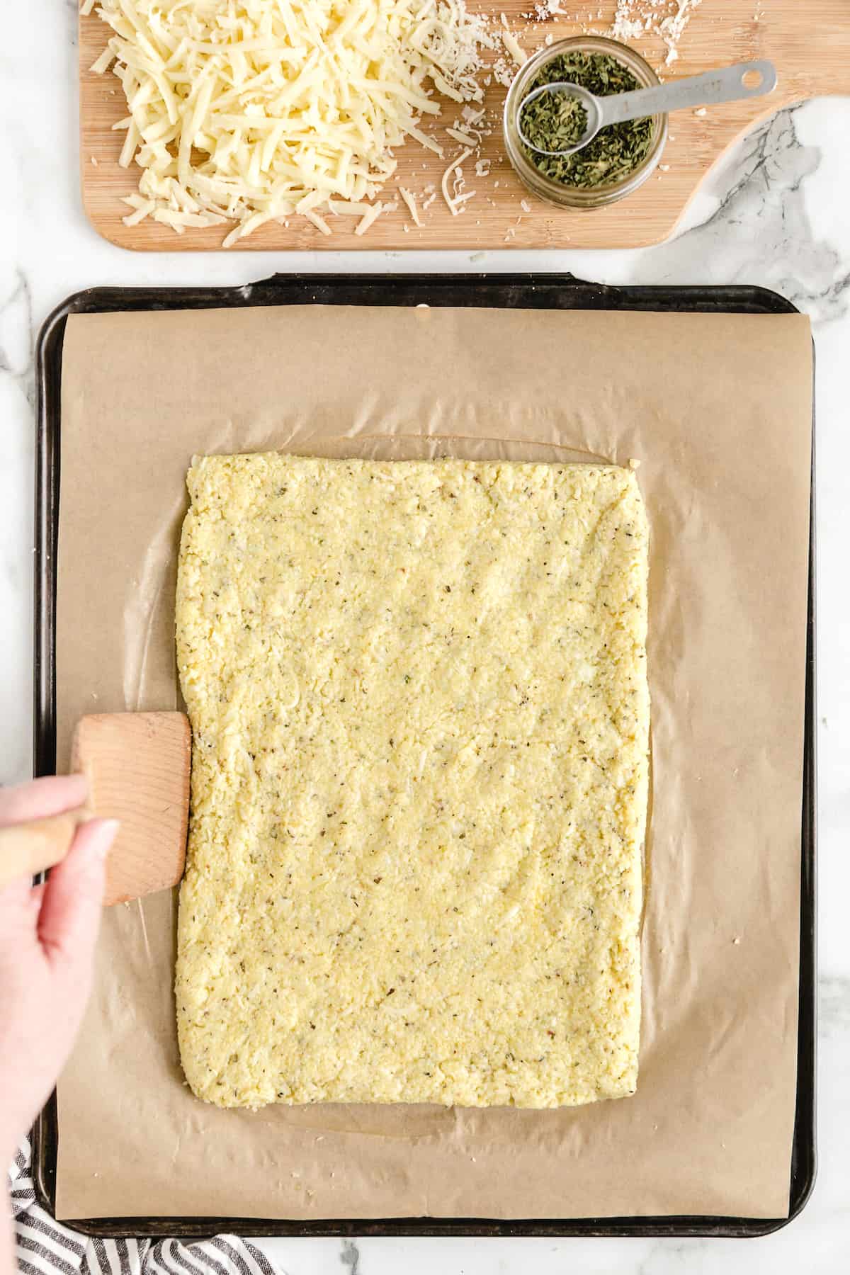 cauliflower dough on baking sheet