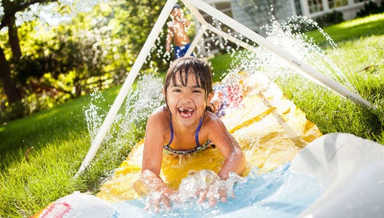 Tunnel of Fun Water Sprinkler - The only thing better than a slip and slide is a slip and slide with water come from all sides! This is an easy DIY project that will keep the kids cool and busy on those hot summer days!