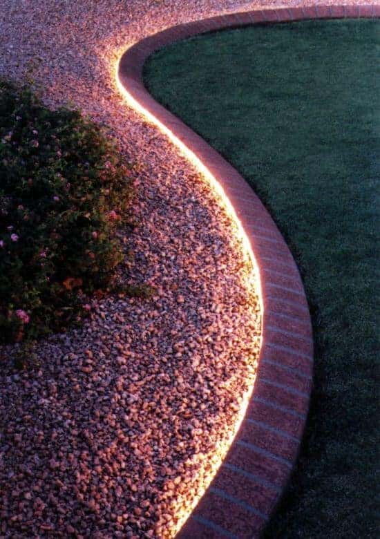 Use rope light to line walkway or edging. Not only is this great to create an illuminating ambience that will make your backyard glow, but it is also great for safety at night!