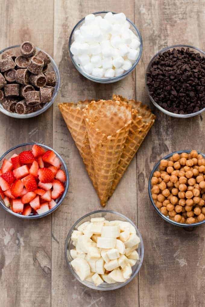 waffle cones, marshmallows, rolos, caramel chips, strawberries and chocolate chips