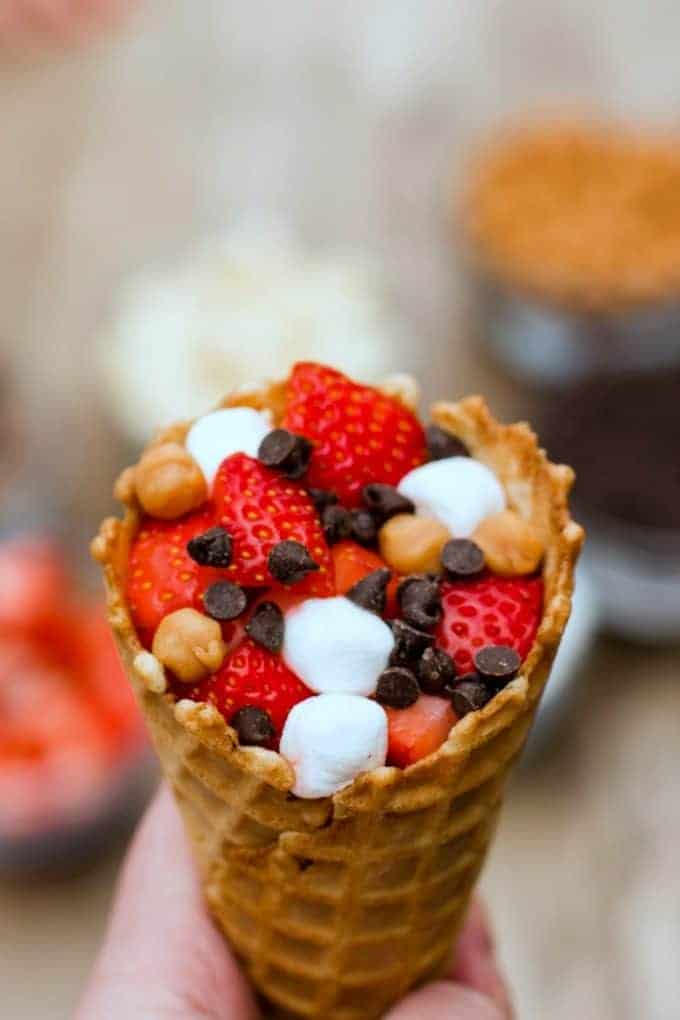 Stuff the waffle cone with fruit and chocolate and marshmallows