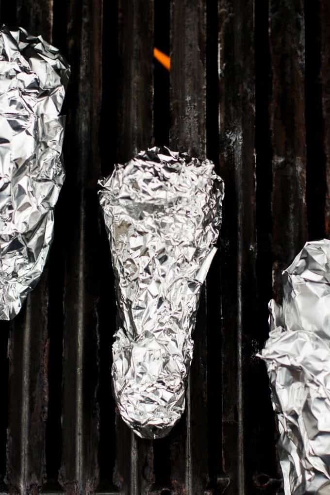 campfire cones wrapped in foil and placed on grill