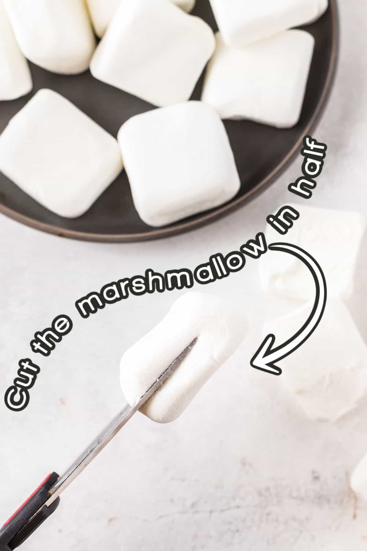 cutting marshmallow in half