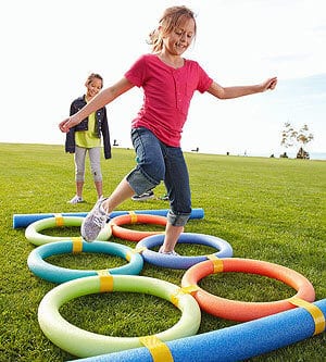 backyard obstacle course with pool noodles