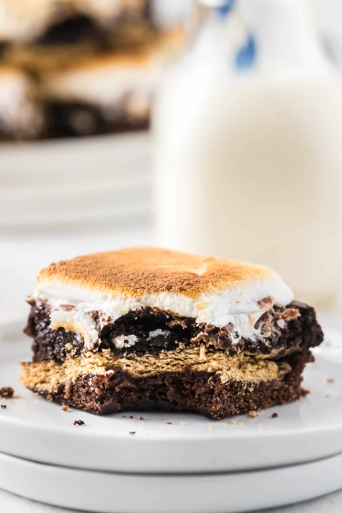 s'more brownies with a bite and milk in the background