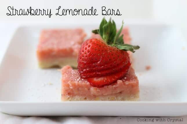 A piece of cake on a plate, with Strawberry and Lemonade