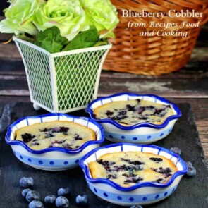 A basket full of food, with Blueberry and Cobbler