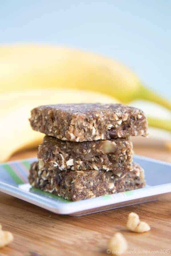 A piece of cake on a plate, with Banana and Bread