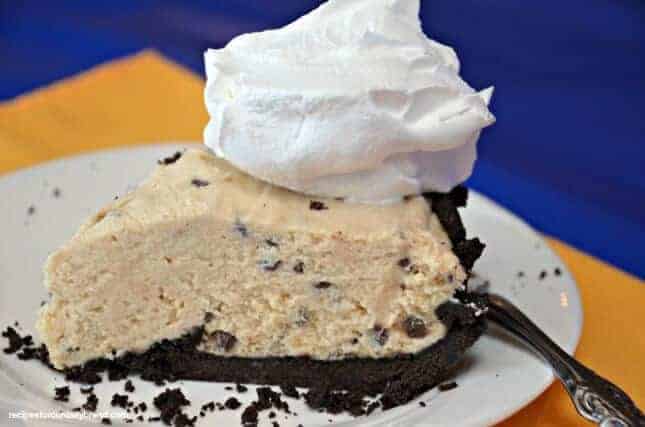 A piece of cake and ice cream on a plate, with Chocolate and Peanut