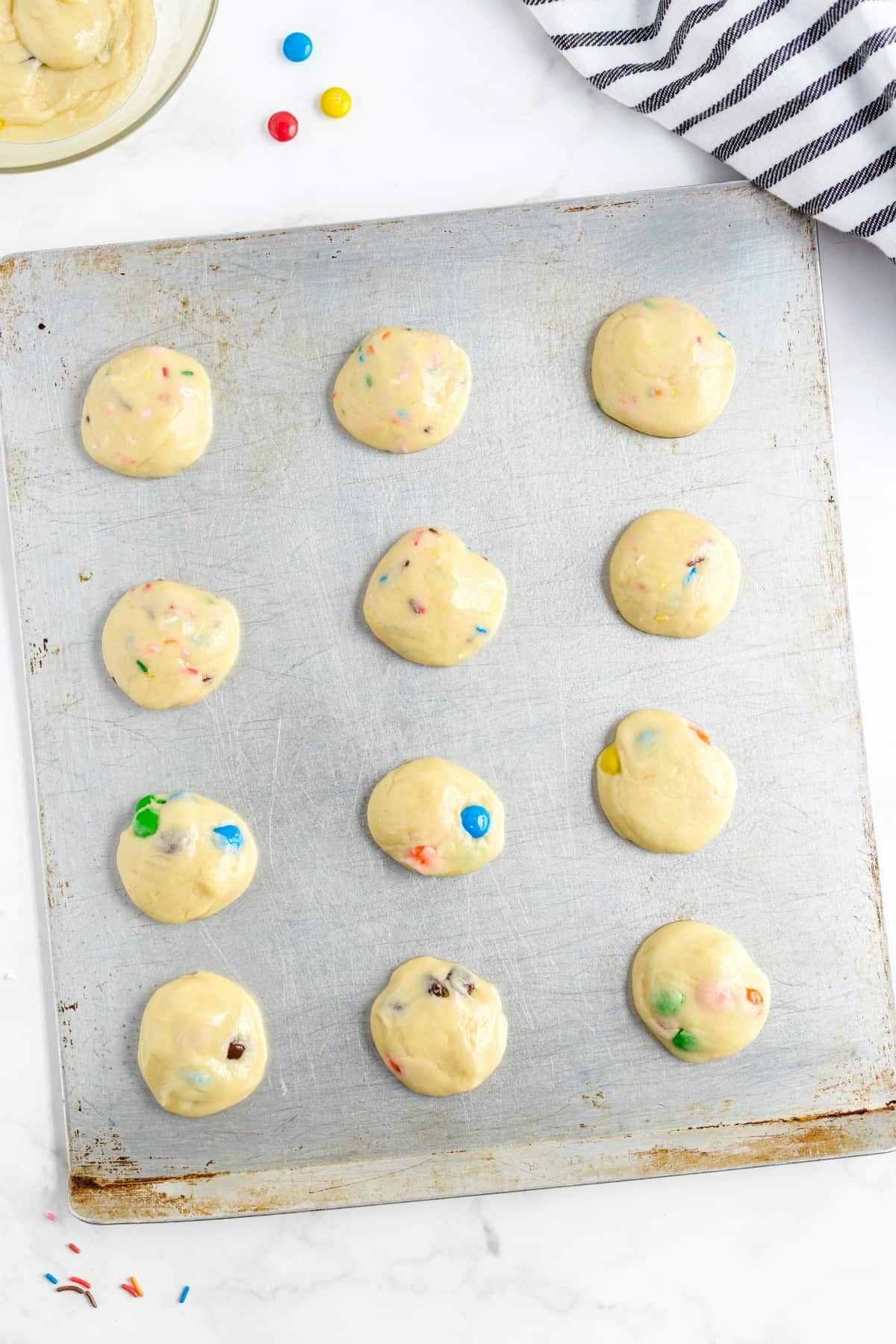 dough balls for cookies on a cookie sheet