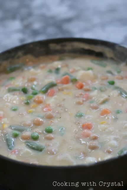 A pot with food in it, with Chickpea and Pot pie