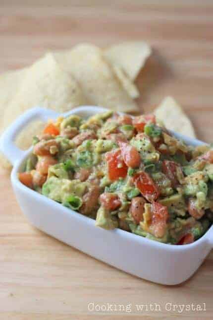 A bowl of food, with Guacamole