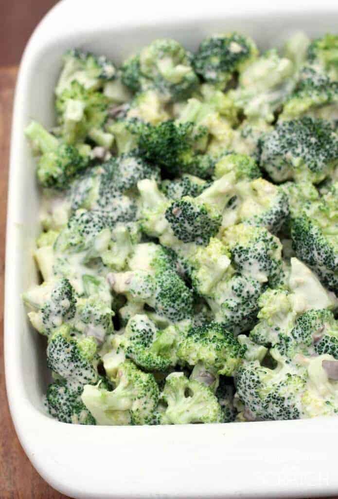 A close up of a bowl of broccoli, with Casserole and Cheese