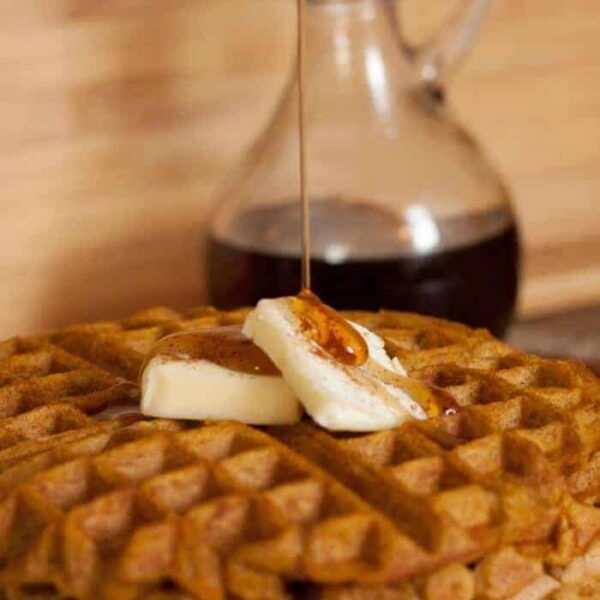 A close up of food on a plate, with Waffle