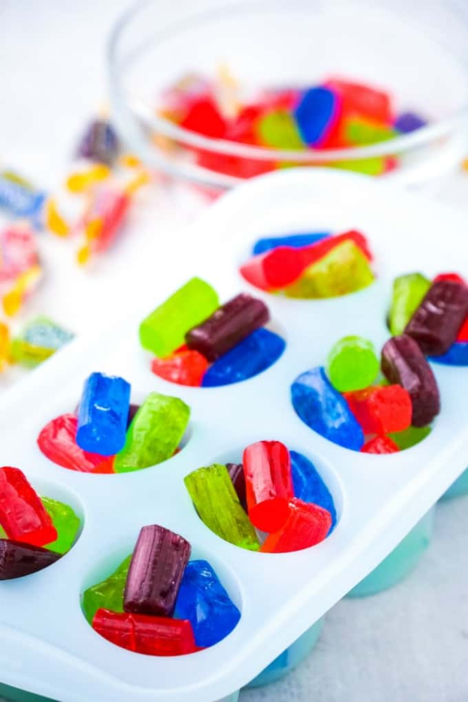 Fill the shot glass mold with Jolly Rancher Candy