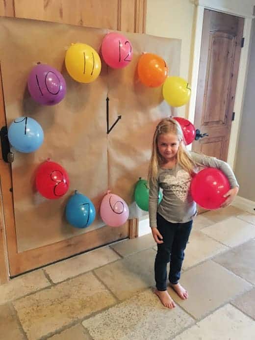 New Year's Eve Ideas for kids - pop a balloon every hour from Toddler Approved