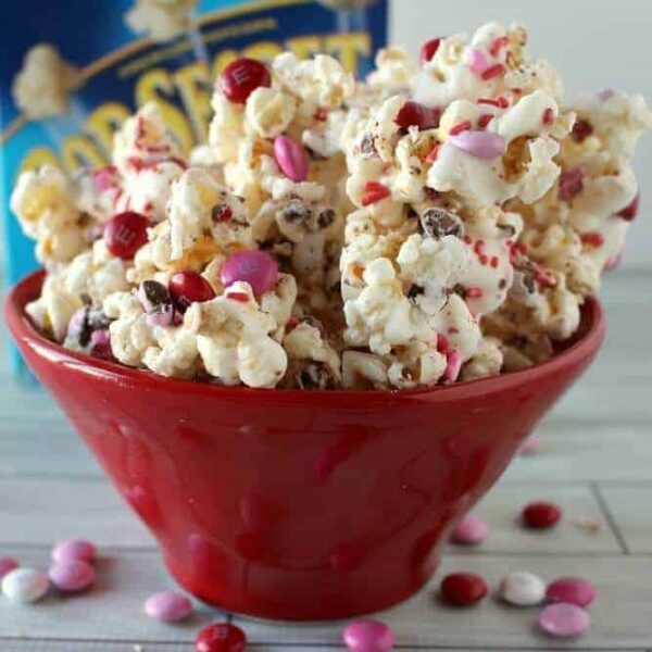A close up of a bowl of food, with Chocolate and Popcorn