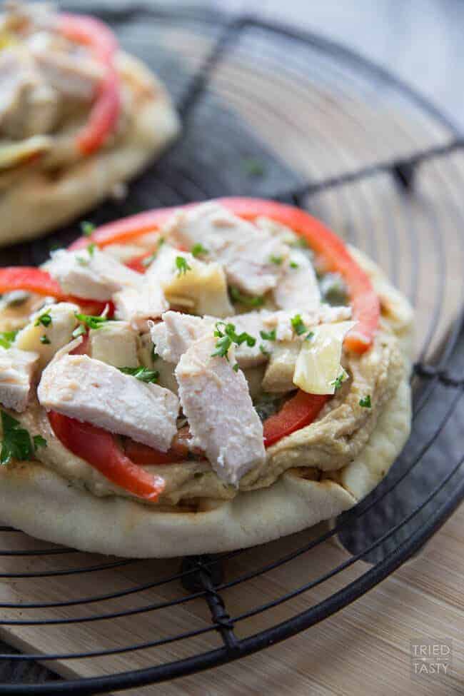 A plate of food with a slice of pizza, with Flatbread