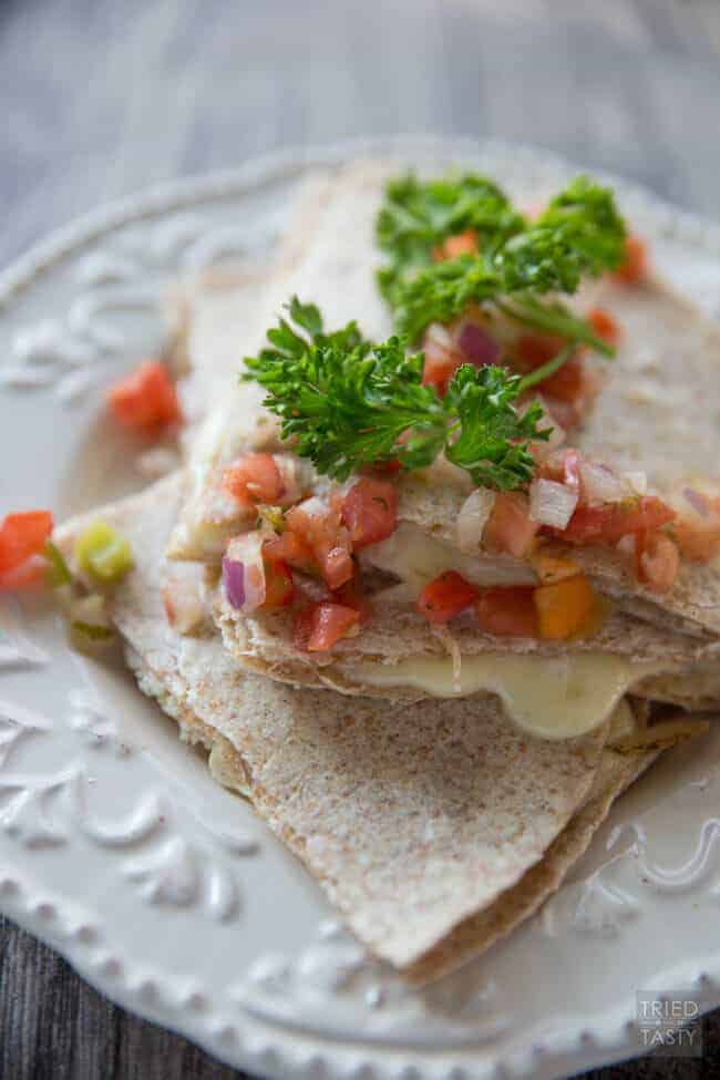 A close up of food on a plate, with Quesadilla