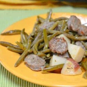 A plate of food, with Sausage