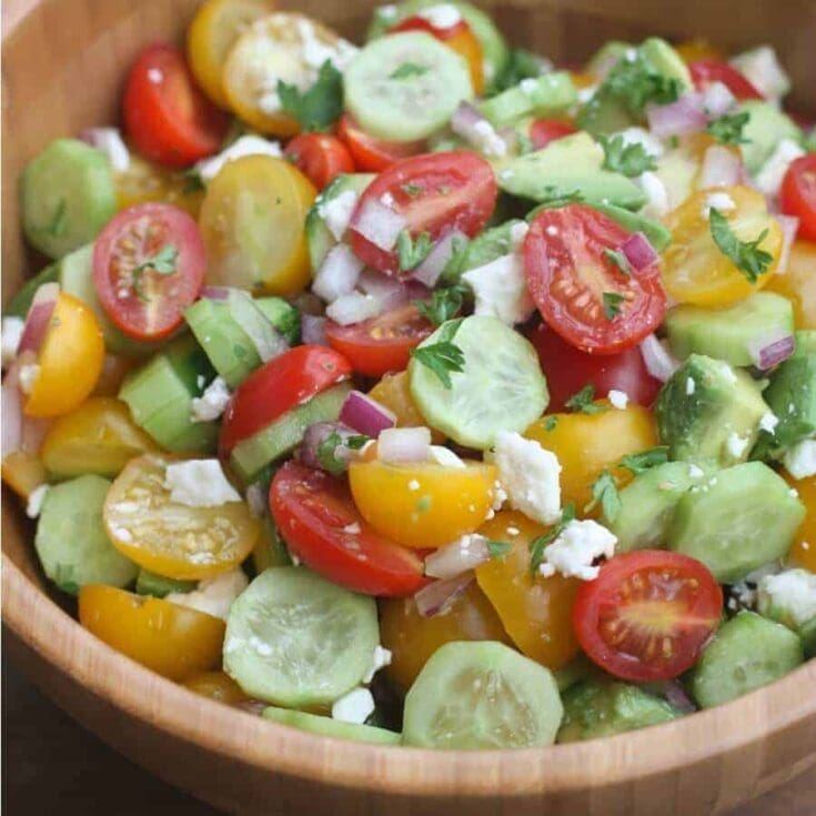 A dish is filled with food, with Avocado and Salad