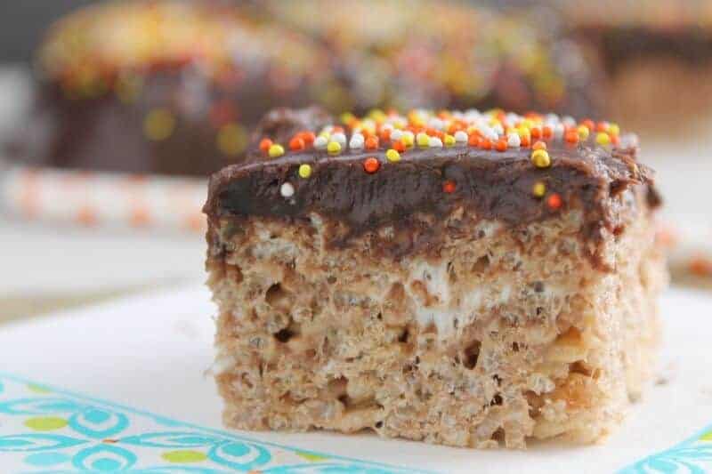 A close up of a piece of chocolate cake on a plate, with Cookie