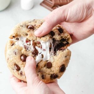 cookie broken open with chocolate chips and marshmallow