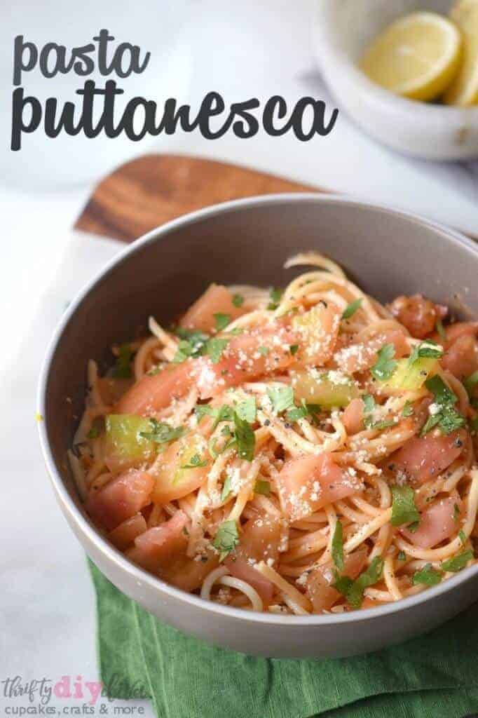 A bowl of food on a plate, with Spaghetti