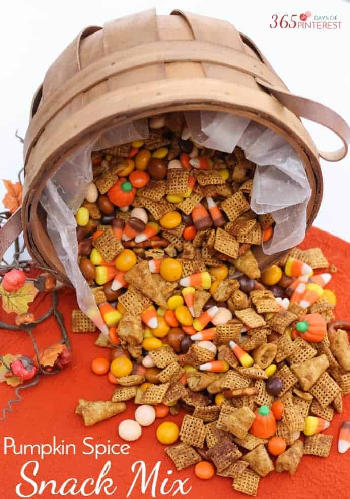 Pumpkin spice check mix spilling out of a basket on a orange table