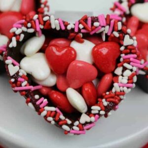 Chocolate heart bowl for Valentine's Day filled with pink and red and white candy
