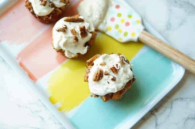 A piece of cake on a plate, with Muffin and Cinnamon roll