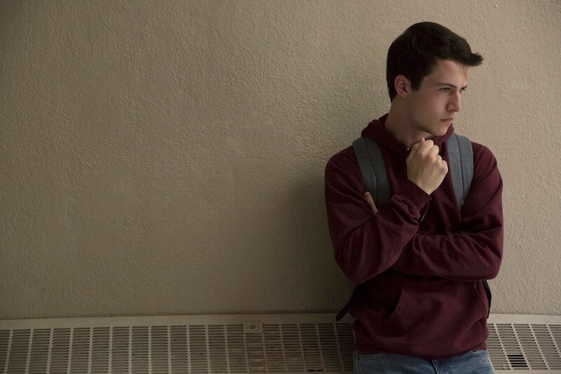 Dylan Minnette talking on a cell phone