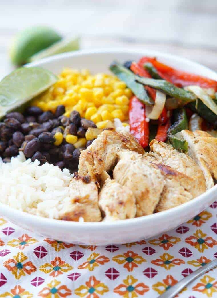 A plate full of food, with Enchilada and Chicken