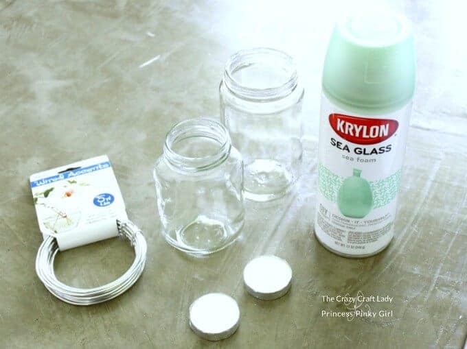 Paint, Mason Jars, wire and candles to make DIY sea glass lanterns. 