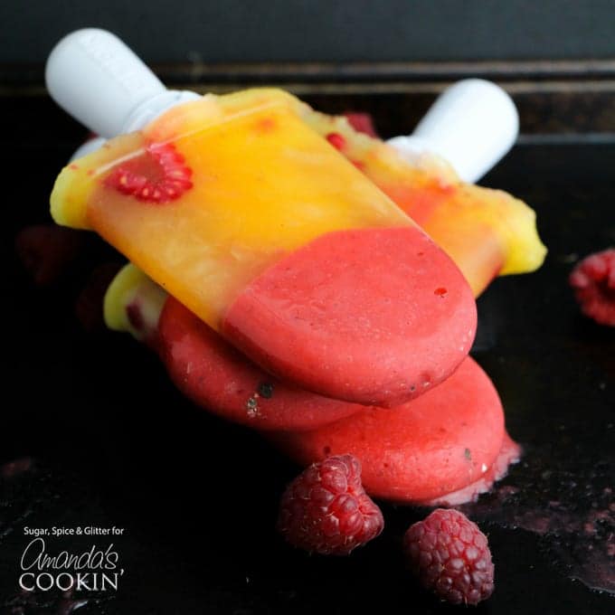 Raspberry Mango Popsicles Infused Vodka and Limoncello with by Amandas Cookin and other amazing adult popsicle recipes!