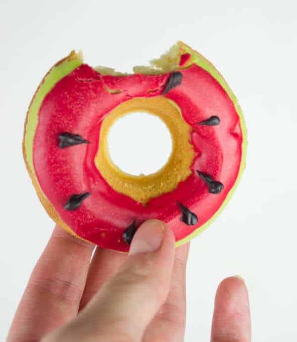 Watermelon doughnuts with a bite