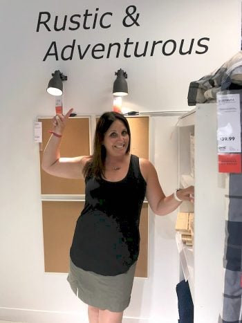 A woman standing in front of a refrigerator