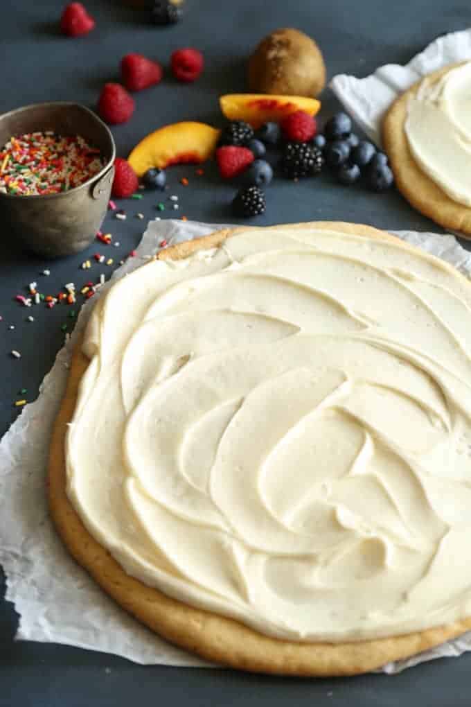 Cream Cheese Frosting on top of a giant sugar cookie