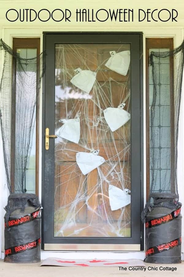 A door decorated with hanging ghosts for Halloween