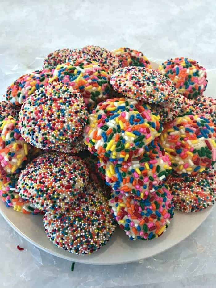 Rainbow Sprinkle Cookies - Delicious sugar cookies that are soft and chewy covered with baked on sprinkles