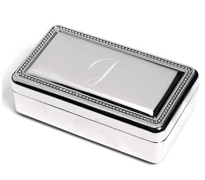 A personalized jewelry box with a J inscribed on it