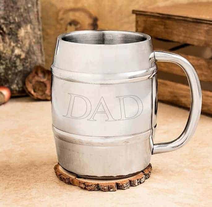A mug on a table With the words dad on it
