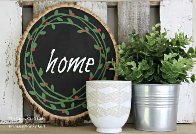 A wood sliced painted wreath makes a gorgeous modern farmhouse type of Christmas decor