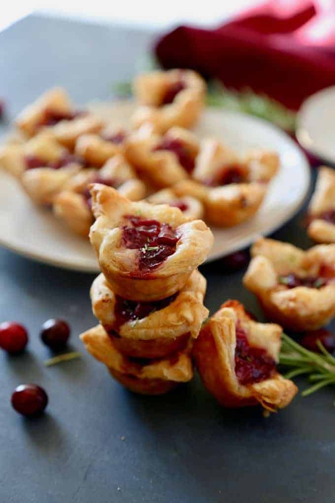 These Cranberry Brie Bites are an easy appetizer to make, festive, and perfect for your holiday party. With only three ingredients keep the focus more on friends and family instead of the food!