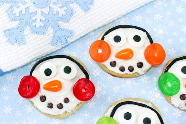 snowman sugar cookie candy eyes, buttercream frosting, chocolate chips