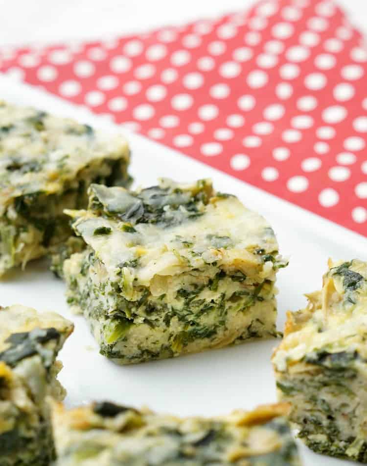 This Spinach and Artichoke Squares will be the most versatile dish on your table! Full of cheese, spinach, and artichokes, everyone's favorite dip becomes an easy side dish recipe!